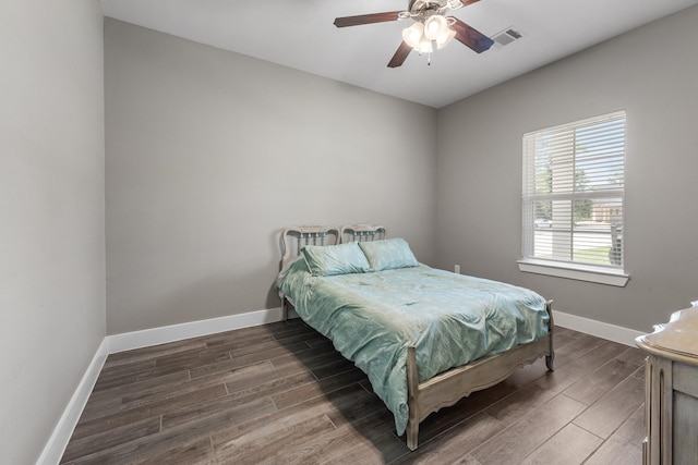8729 Nathan Dr, Waller, TX 77484 - bedroom featuring wood finished floors, baseboards, and ceiling fan