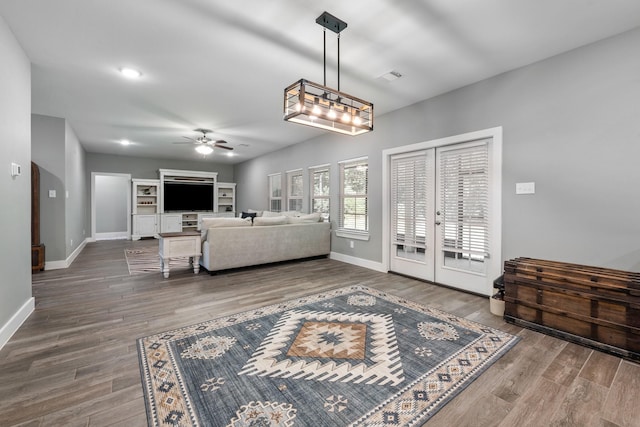 8729 Nathan Dr, Waller, TX 77484 - living area with a ceiling fan, baseboards, and wood finished floors