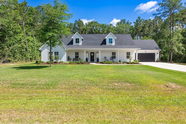 8729 Nathan Dr, Waller, TX 77484 - new england style home featuring a garage, covered porch, concrete driveway, and a front yard