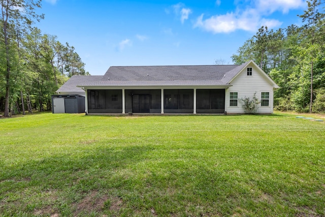 8729 Nathan Dr, Waller, TX 77484 - back of property with a sunroom, roof with shingles, a yard, and a storage unit