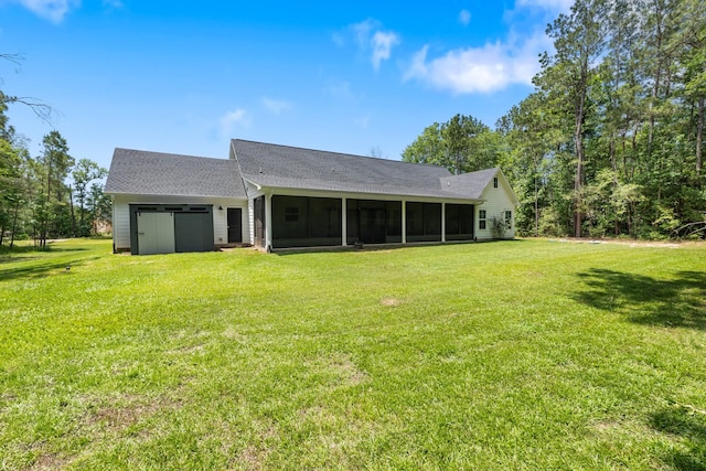 8729 Nathan Dr, Waller, TX 77484 - back of property with a sunroom, an attached garage, a lawn, and a shingled roof