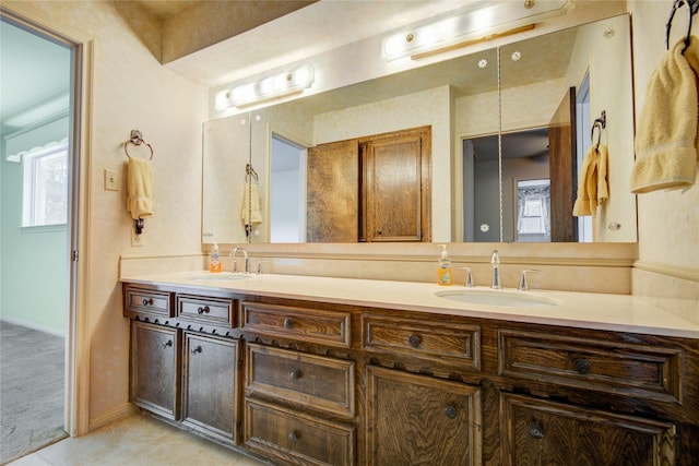 5211 Olympia Fields Ln, Houston, TX 77069 - bathroom with double vanity, healthy amount of natural light, and baseboards