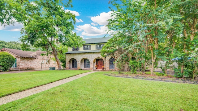 5211 Olympia Fields Ln, Houston, TX 77069 - view of front of home with a front yard and brick siding