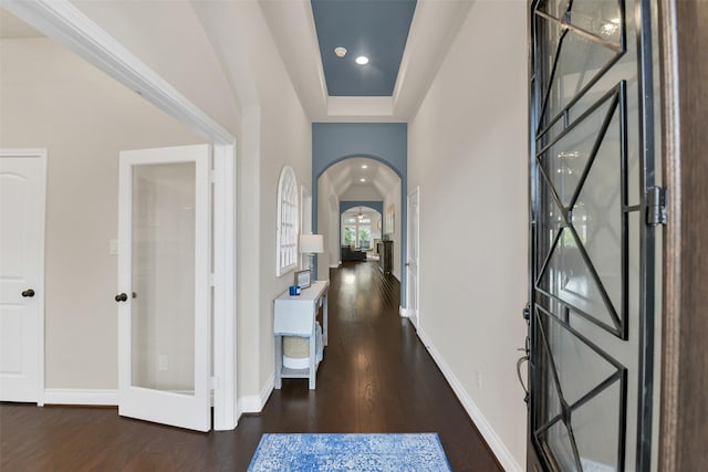 16819 Big Reed Dr, Humble, TX 77346 - entryway with arched walkways, wood finished floors, baseboards, and recessed lighting