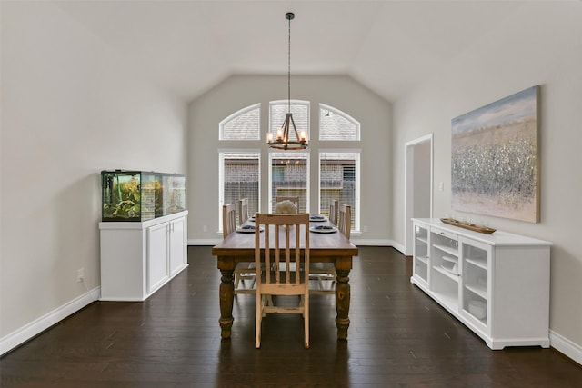 16819 Big Reed Dr, Humble, TX 77346 - dining room with a chandelier, dark wood-style flooring, baseboards, and lofted ceiling