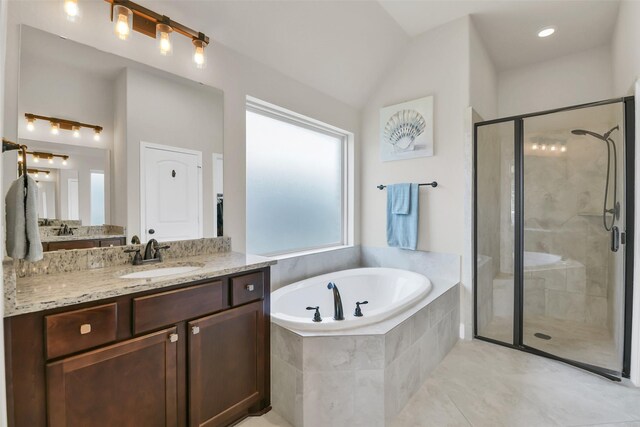 16819 Big Reed Dr, Humble, TX 77346 - bathroom featuring a garden tub, a shower stall, vanity, and tile patterned flooring