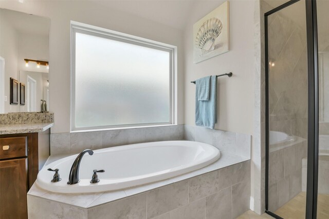 16819 Big Reed Dr, Humble, TX 77346 - full bathroom with a stall shower, vanity, and a bath