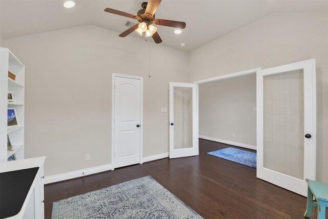16819 Big Reed Dr, Humble, TX 77346 - unfurnished bedroom featuring french doors, vaulted ceiling, wood finished floors, baseboards, and a ceiling fan