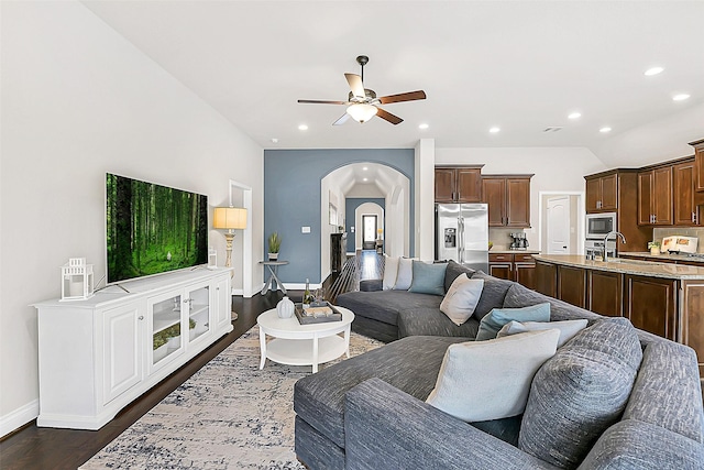 16819 Big Reed Dr, Humble, TX 77346 - living area with a ceiling fan, baseboards, arched walkways, dark wood finished floors, and recessed lighting
