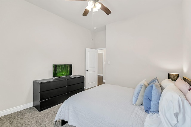 16819 Big Reed Dr, Humble, TX 77346 - carpeted bedroom with baseboards, a ceiling fan, and a high ceiling