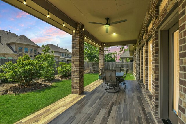16819 Big Reed Dr, Humble, TX 77346 - wooden deck with outdoor dining area and a ceiling fan