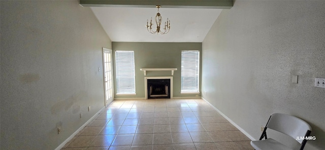 10211 Sugar Branch Dr Unit 444, Houston, TX 77036 - unfurnished living room featuring vaulted ceiling, plenty of natural light, a chandelier, a textured wall, and a fireplace