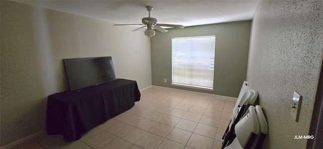 10211 Sugar Branch Dr Unit 444, Houston, TX 77036 - unfurnished living room featuring a ceiling fan and light tile patterned flooring