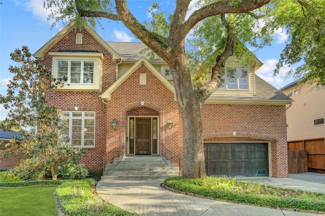 3711 Tartan Ln, Houston, TX 77025 - view of front of home with brick siding, an attached garage, fence, and a shingled roof