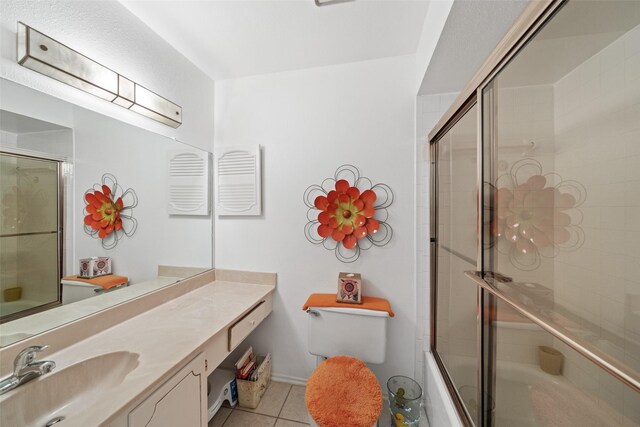 14911 Wunderlich Dr Unit 1501, Houston, TX 77069 - full bathroom with tile patterned flooring, vanity, bath / shower combo with glass door, and toilet