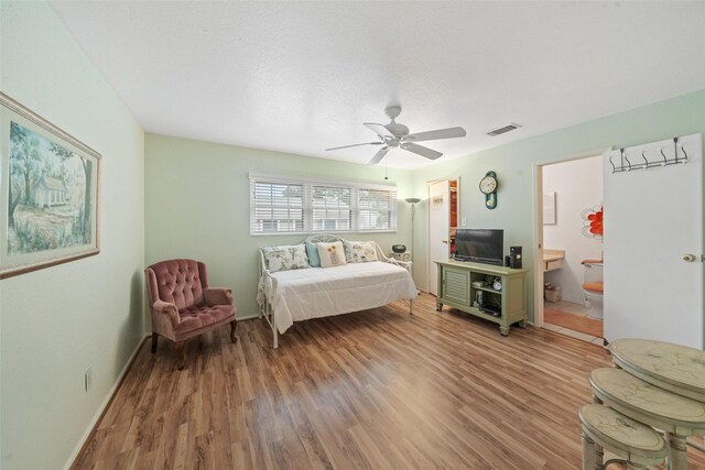 14911 Wunderlich Dr Unit 1501, Houston, TX 77069 - bedroom with light wood finished floors, ceiling fan, and ensuite bathroom