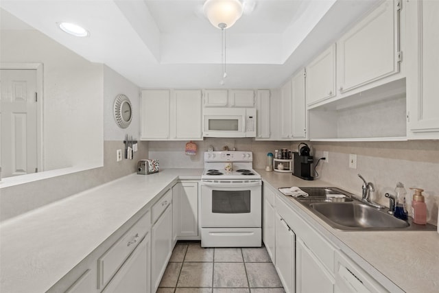 14911 Wunderlich Dr Unit 1501, Houston, TX 77069 - kitchen featuring white appliances, a sink, a raised ceiling, and light countertops