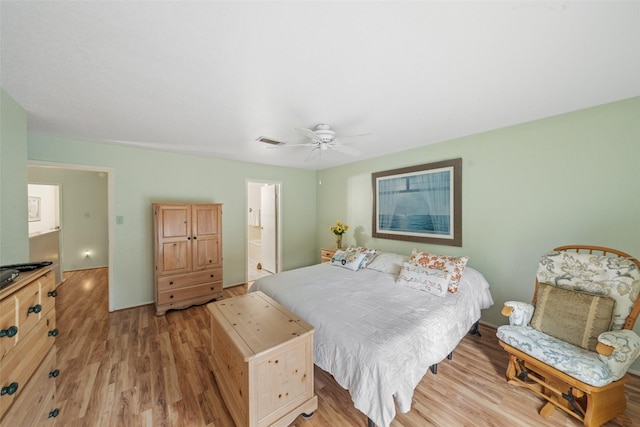 14911 Wunderlich Dr Unit 1501, Houston, TX 77069 - bedroom with light wood-type flooring and ceiling fan