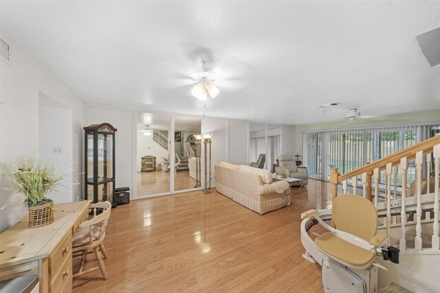 14911 Wunderlich Dr Unit 1501, Houston, TX 77069 - living area with a ceiling fan and light wood-style flooring