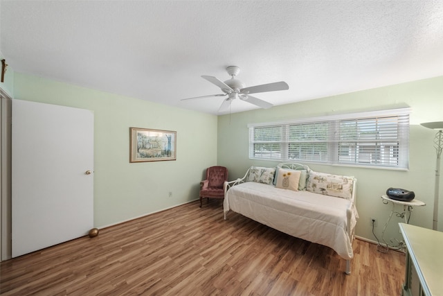 14911 Wunderlich Dr Unit 1501, Houston, TX 77069 - bedroom with light wood finished floors and ceiling fan