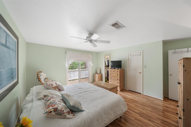 14911 Wunderlich Dr Unit 1501, Houston, TX 77069 - bedroom featuring wood finished floors, access to outside, and a ceiling fan