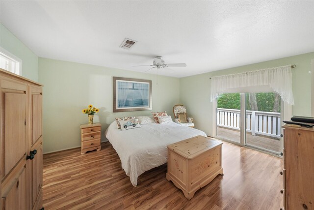 14911 Wunderlich Dr Unit 1501, Houston, TX 77069 - bedroom featuring access to exterior, light wood-style flooring, and ceiling fan