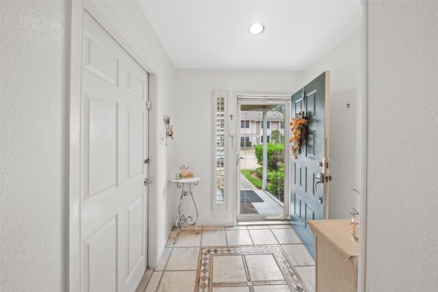 14911 Wunderlich Dr Unit 1501, Houston, TX 77069 - entryway featuring inlaid floor details, light tile patterned flooring, and recessed lighting