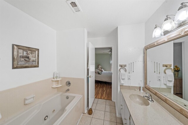 14911 Wunderlich Dr Unit 1501, Houston, TX 77069 - bathroom with ensuite bath, tile patterned flooring, a jetted tub, vanity, and ceiling fan