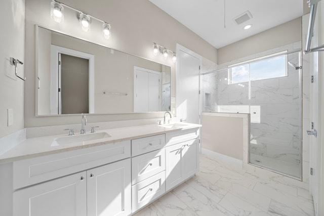 9 Wellford St Unit F, Houston, TX 77022 - bathroom featuring a marble finish shower, marble look tile flooring, and double vanity