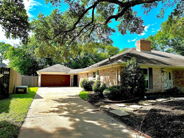 3007 Broadmoor Dr, Sugar Land, TX 77478 - single story home with a garage, a chimney, fence, concrete driveway, and brick siding