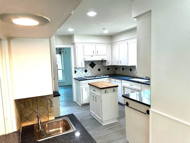 3007 Broadmoor Dr, Sugar Land, TX 77478 - kitchen featuring a sink, wood counters, under cabinet range hood, white appliances, and light wood-type flooring