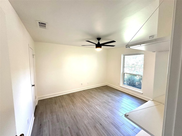 3007 Broadmoor Dr, Sugar Land, TX 77478 - spare room featuring wood finished floors, a ceiling fan, and baseboards