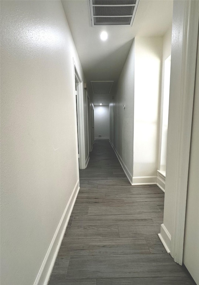 3007 Broadmoor Dr, Sugar Land, TX 77478 - corridor featuring baseboards, dark wood-style flooring, and attic access