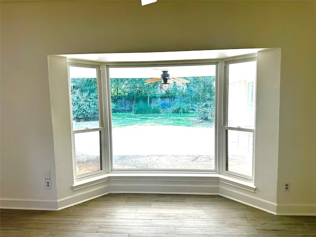 3007 Broadmoor Dr, Sugar Land, TX 77478 - doorway with baseboards, wood finished floors, and a ceiling fan