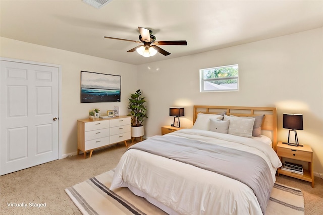 401 S Fig St, Sweeny, TX 77480 - bedroom featuring baseboards, ceiling fan, and light colored carpet
