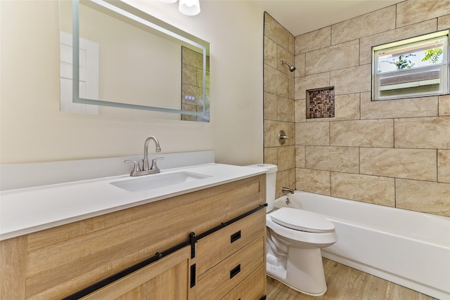 401 S Fig St, Sweeny, TX 77480 - full bathroom featuring wood finished floors, toilet, vanity, and  shower combination