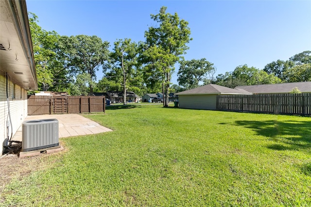 401 S Fig St, Sweeny, TX 77480 - view of yard featuring central air condition unit, a gate, and a patio