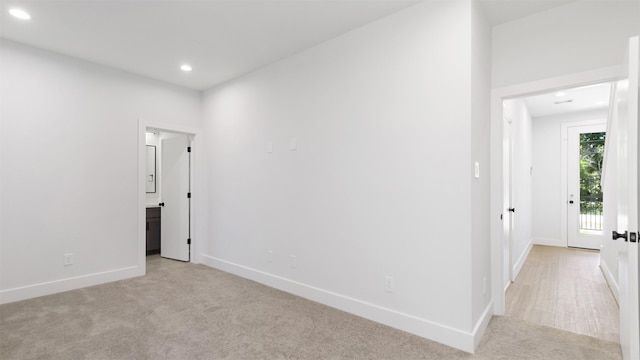 3605 Mount Pleasant St, Houston, TX 77021 - unfurnished room with light colored carpet, baseboards, and recessed lighting