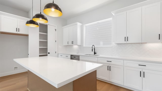 3605 Mount Pleasant St, Houston, TX 77021 - kitchen with a sink, tasteful backsplash, light countertops, and light wood finished floors