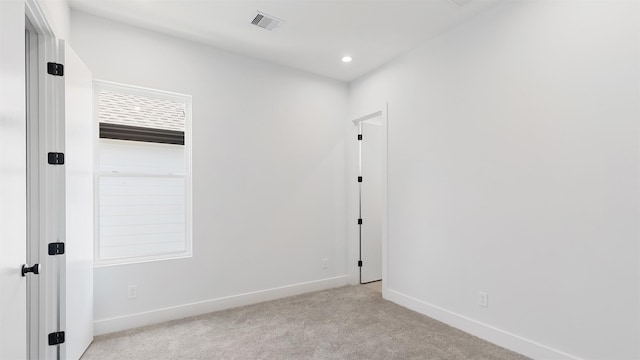 3605 Mount Pleasant St, Houston, TX 77021 - spare room with light carpet, baseboards, and recessed lighting