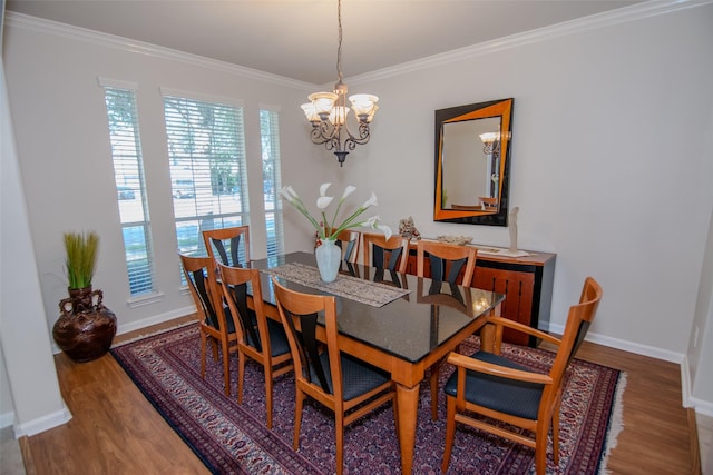 20018 Rene Creek Ct, Spring, TX 77388 - dining area featuring a chandelier, wood finished floors, crown molding, and baseboards