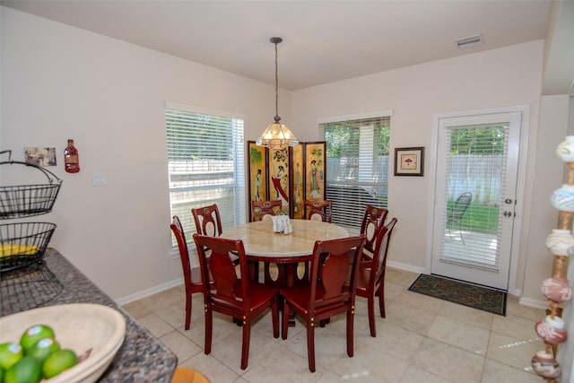 20018 Rene Creek Ct, Spring, TX 77388 - dining room featuring a chandelier, healthy amount of natural light, and baseboards