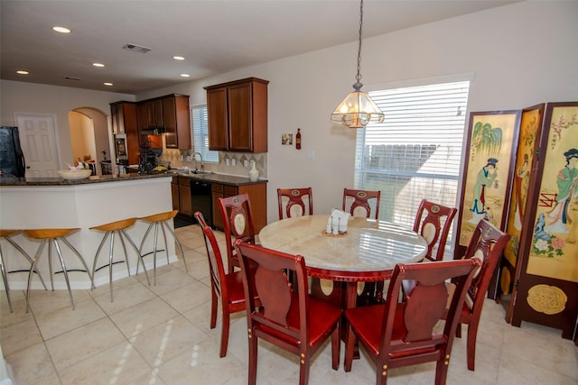 20018 Rene Creek Ct, Spring, TX 77388 - dining room featuring arched walkways, light tile patterned floors, recessed lighting, and a chandelier