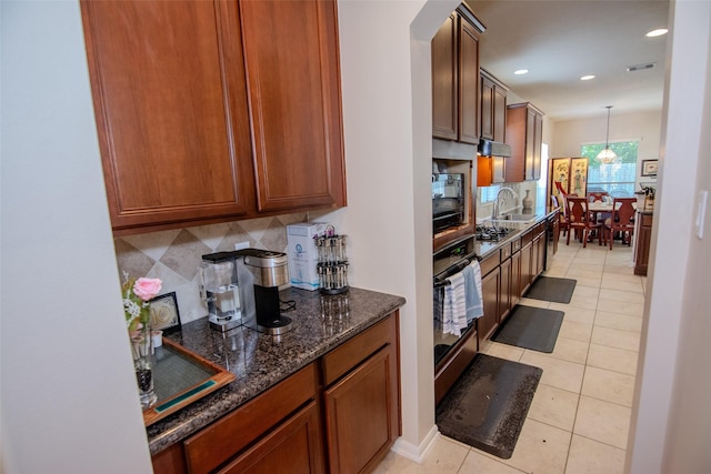 20018 Rene Creek Ct, Spring, TX 77388 - kitchen with a sink, black appliances, tasteful backsplash, light tile patterned floors, and recessed lighting