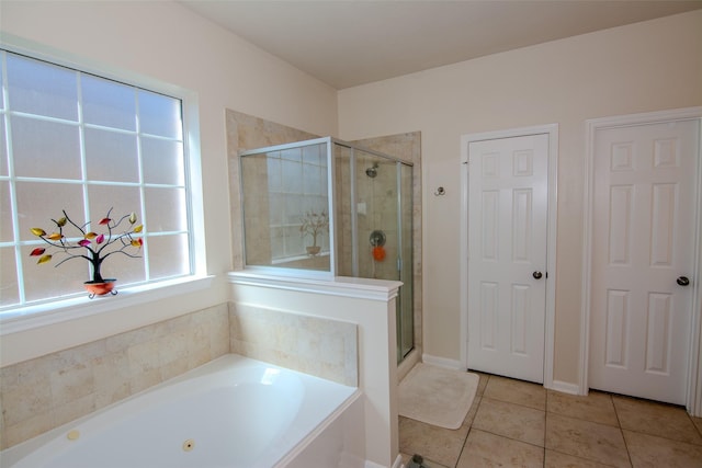 20018 Rene Creek Ct, Spring, TX 77388 - full bath featuring tile patterned floors, a shower stall, and a bath