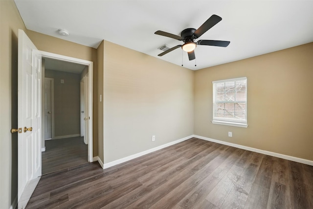 3615 Seabrook St, Houston, TX 77021 - empty room with dark wood-style flooring, baseboards, ceiling fan, and a smoke detector