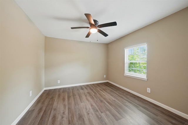 3615 Seabrook St, Houston, TX 77021 - spare room with wood finished floors, baseboards, and ceiling fan