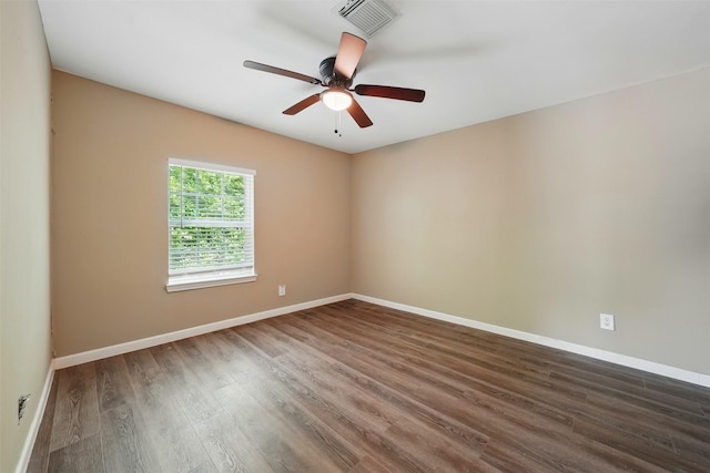 3615 Seabrook St, Houston, TX 77021 - unfurnished room featuring dark wood-style floors, a ceiling fan, and baseboards