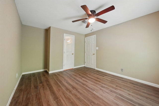 3615 Seabrook St, Houston, TX 77021 - unfurnished bedroom with baseboards, wood finished floors, and a ceiling fan