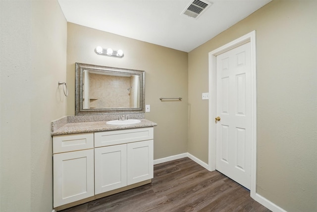3615 Seabrook St, Houston, TX 77021 - bathroom with wood finished floors, vanity, and baseboards